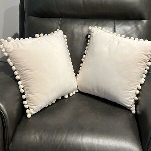 Pair of cream colored Pom Pom pillows